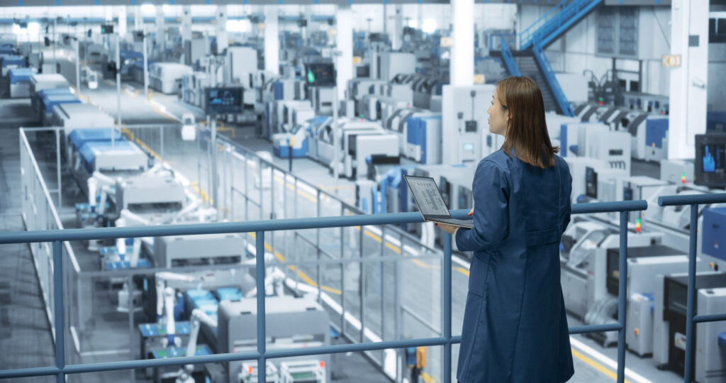 continuous improvement ROI manufacturing team calculating ROI metrics for a lean improvement project.