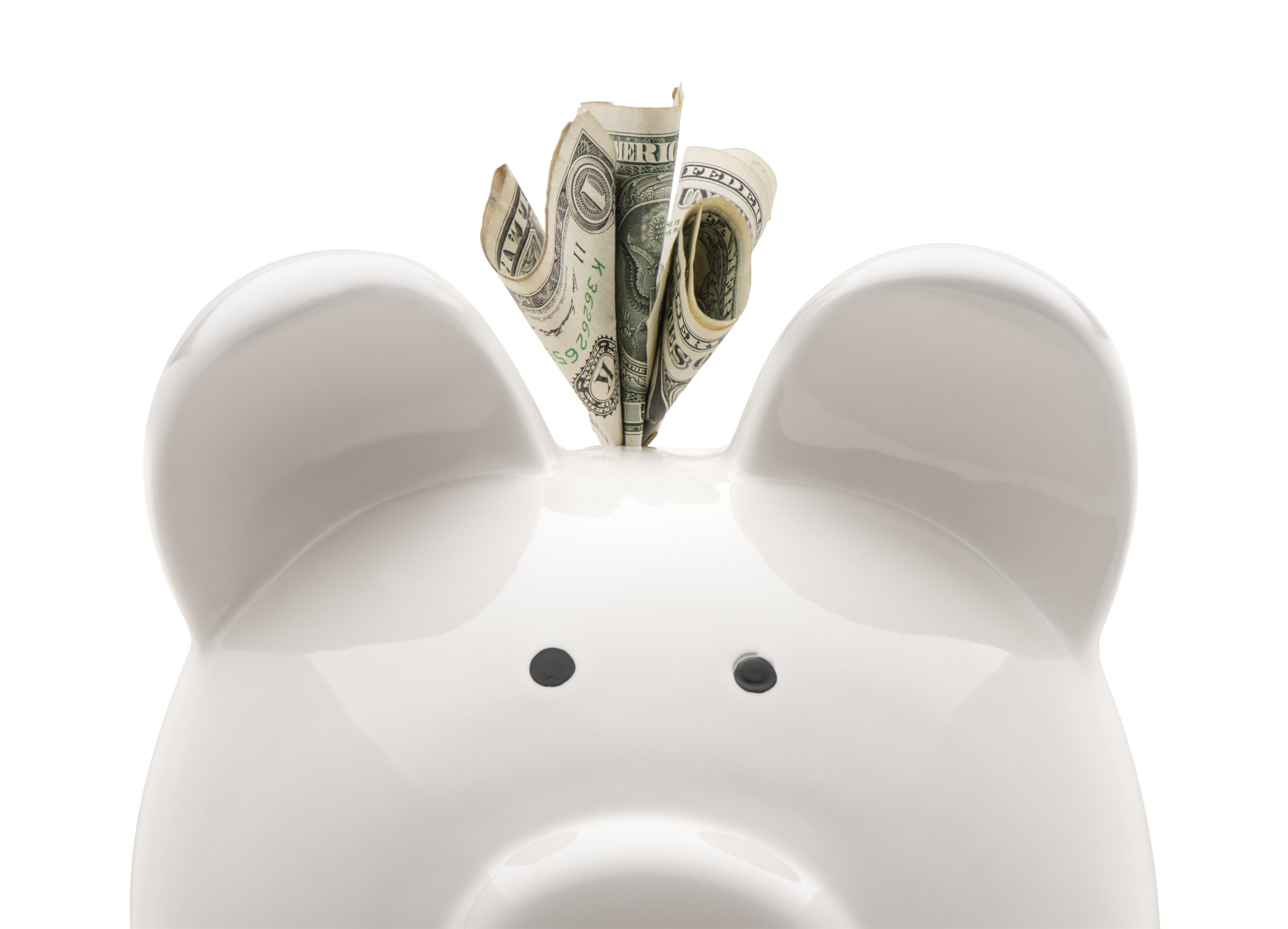 A white piggy bank saving money